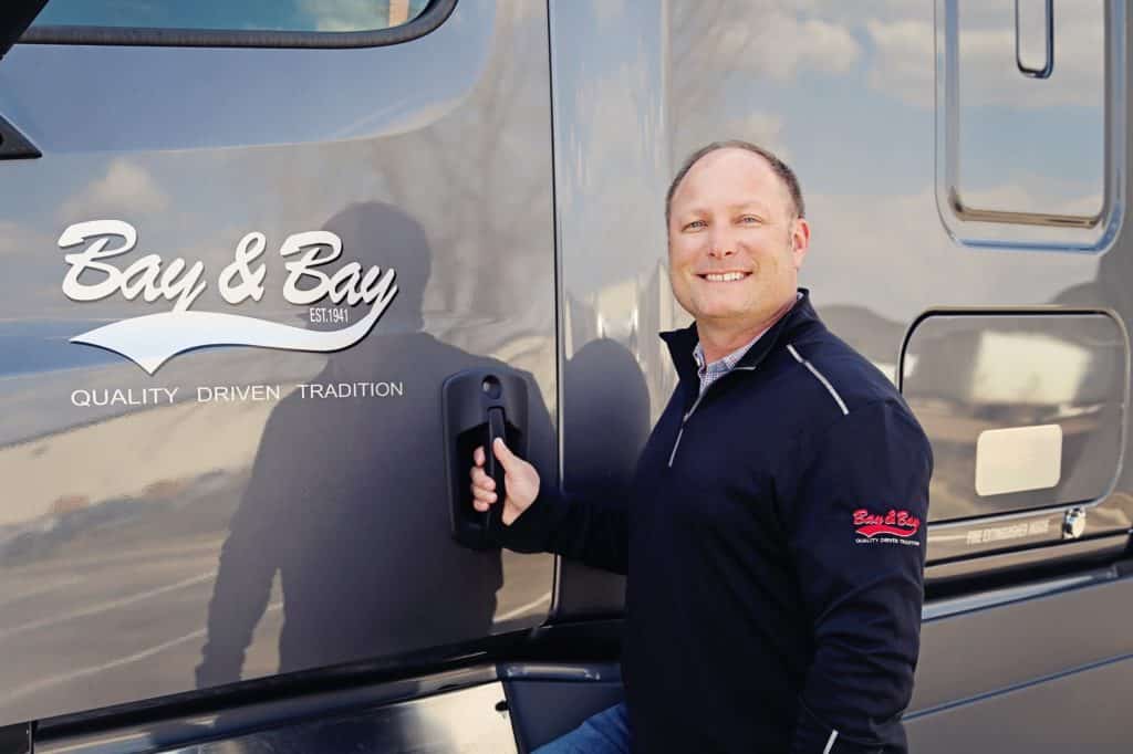 man standing by truck door