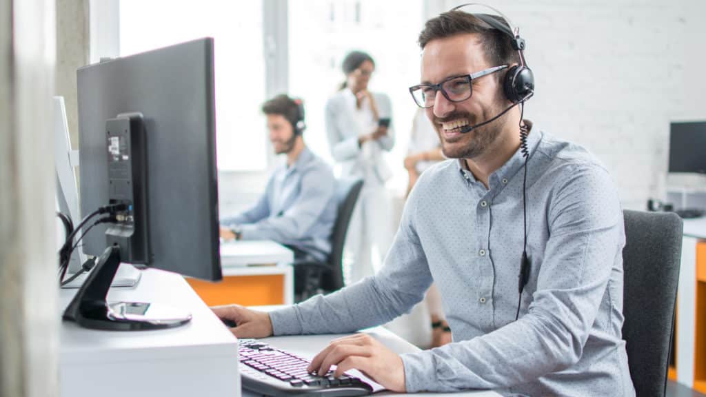 Smiling customer service representative on the phone with a customer; Start your career in trucking and logistics to not only learn more about the industry, but to also become a better employee by gaining new skills, learning to deal with new tasks daily, and to open new opportunities for yourself.