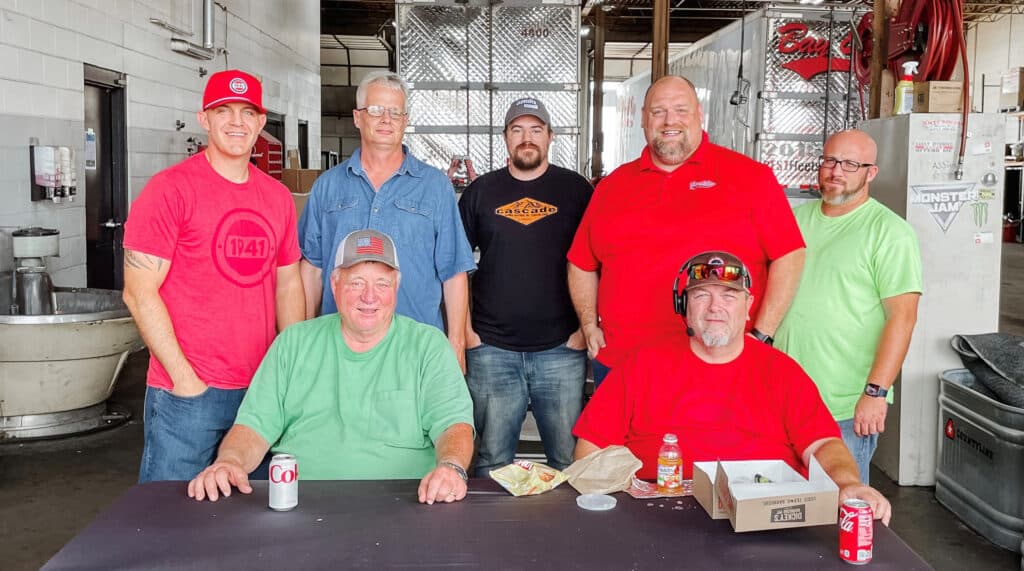 A photo from Bay & Bay's National Truck Driver Appreciation Week in 2022. The photo is of Bay & Bay truck drivers with other members of our corporate team showing appreciation with free lunch.