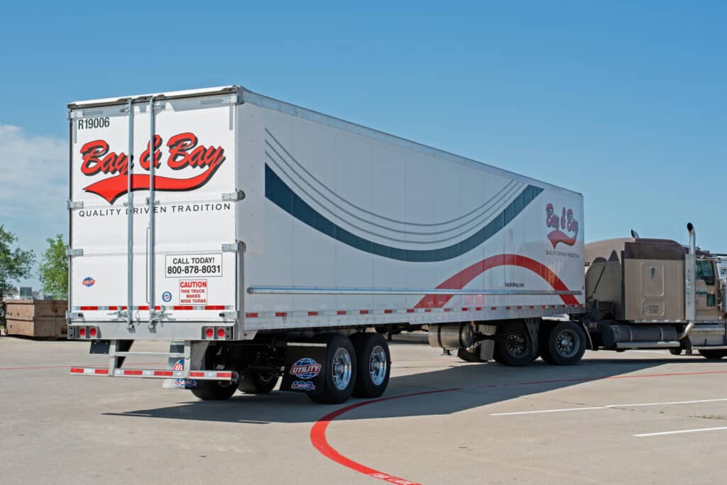 A photo of one of Bay & Bay's expert refrigerated transport trailers. This trailer is getting ready for a shipment throughout the cold chain and represents Bay & Bay's expertise in refrigerated transport.